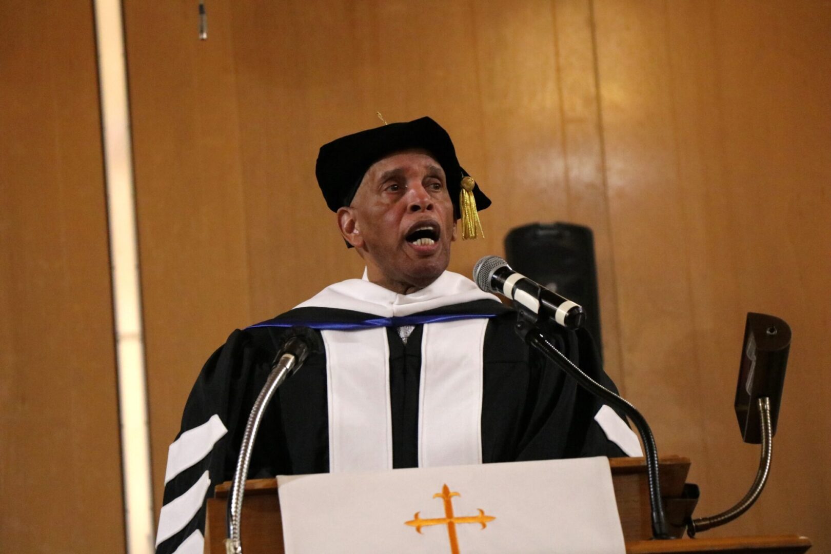 Portrait of person talking in front of podium